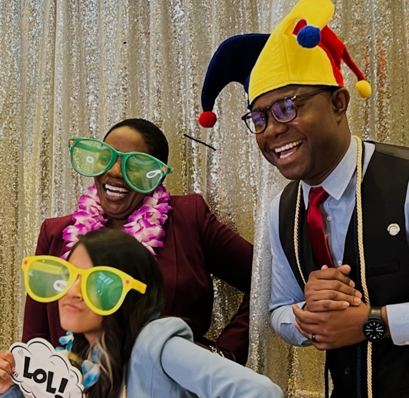 Photo Booth Guests wearing, glasses and holding signs having fun