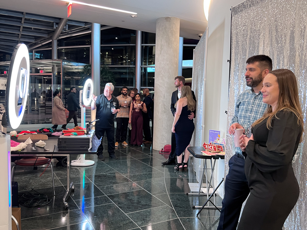 Two Photo Booths in Action at a coporate party