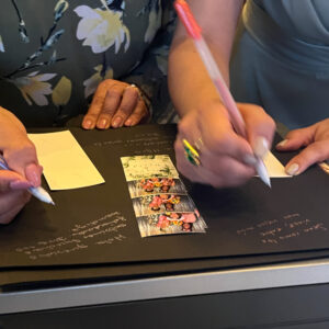 Photo Booth Guests Signing Scrap Book Photo Booth Guests Signing Scrap Book