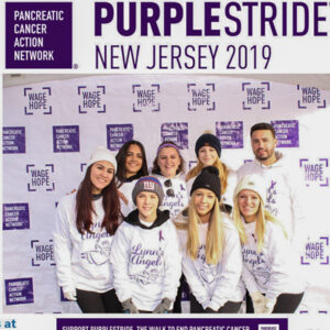 Purple Stride Photo Booth In action with step and repeat background Purple Stride Photo Booth In action with step and repeat background